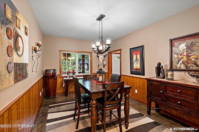 4051 Twilight Ln, Anchorage, AK 99516 - dining space featuring wainscoting, wooden walls, and a chandelier