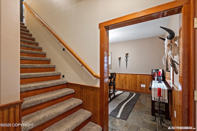 4051 Twilight Ln, Anchorage, AK 99516 - stairway with wood walls, wainscoting, and stone finish flooring