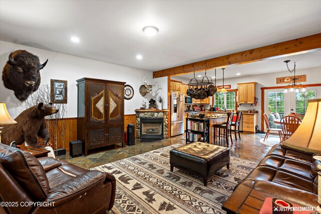 4051 Twilight Ln, Anchorage, AK 99516 - living room with a wainscoted wall, recessed lighting, wooden walls, a chandelier, and beamed ceiling