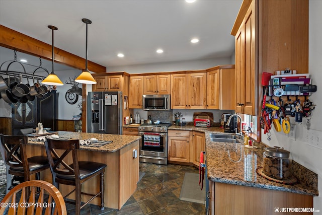 4051 Twilight Ln, Anchorage, AK 99516 - kitchen with stainless steel appliances, stone countertops, a kitchen breakfast bar, stone finish flooring, and recessed lighting