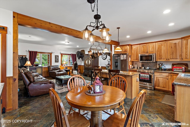 4051 Twilight Ln, Anchorage, AK 99516 - dining area featuring stone tile flooring, recessed lighting, and beamed ceiling