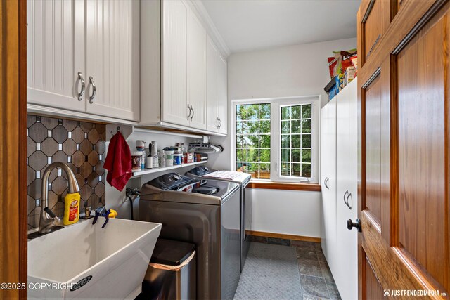 4051 Twilight Ln, Anchorage, AK 99516 - laundry room with cabinet space, washing machine and dryer, and dark stone finish floors