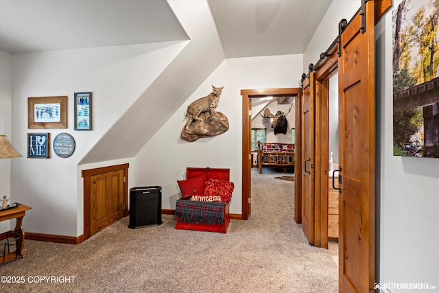4051 Twilight Ln, Anchorage, AK 99516 - sitting room featuring a barn door, light carpet, and plenty of natural light