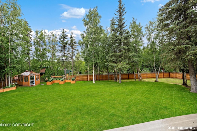 4051 Twilight Ln, Anchorage, AK 99516 - fenced backyard featuring an outbuilding and view of scattered trees