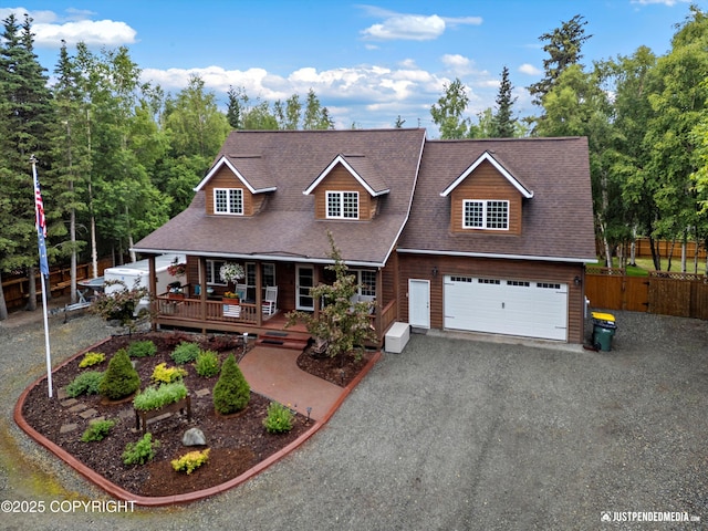 4051 Twilight Ln, Anchorage, AK 99516 - view of front facade with covered porch, asphalt driveway, an attached garage, and a shingled roof