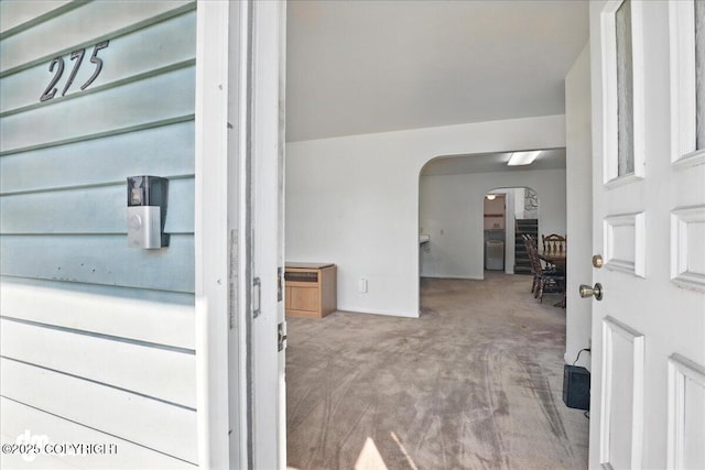 275 S Hoyt St, Anchorage, AK 99508 - carpeted entrance foyer with arched walkways and baseboards