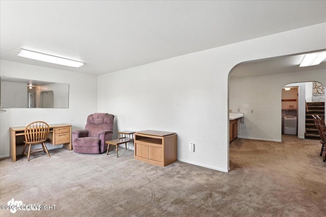 275 S Hoyt St, Anchorage, AK 99508 - living area featuring arched walkways and carpet flooring