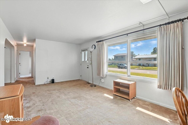 275 S Hoyt St, Anchorage, AK 99508 - unfurnished living room with carpet floors and baseboards