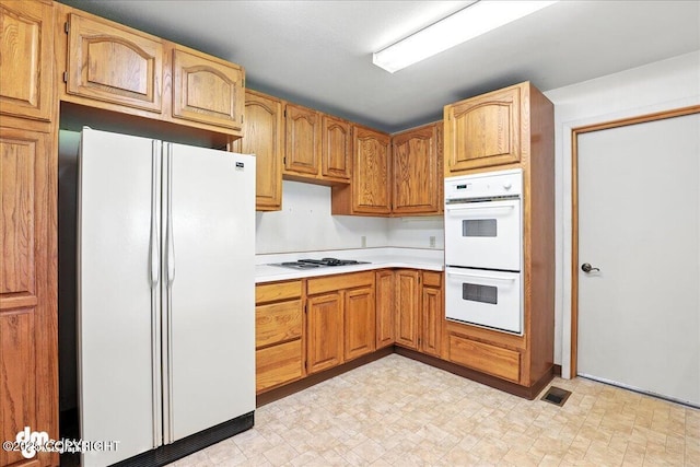 275 S Hoyt St, Anchorage, AK 99508 - kitchen with white appliances and light countertops