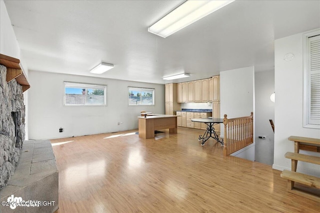 275 S Hoyt St, Anchorage, AK 99508 - interior space featuring a fireplace with raised hearth and light wood-style floors