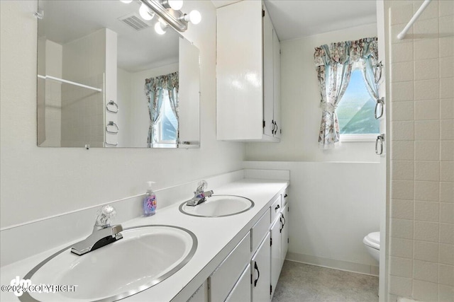 275 S Hoyt St, Anchorage, AK 99508 - bathroom with double vanity and tiled shower