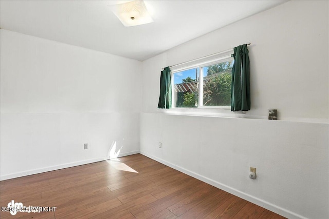275 S Hoyt St, Anchorage, AK 99508 - empty room with wood finished floors