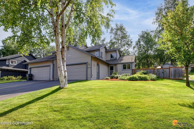 9606 Reliance Dr, Anchorage, AK 99507 - traditional-style house featuring driveway and a garage