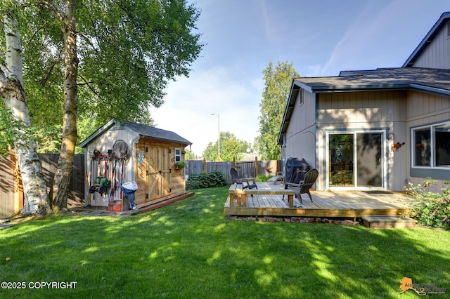 9606 Reliance Dr, Anchorage, AK 99507 - fenced backyard with a storage unit and a deck