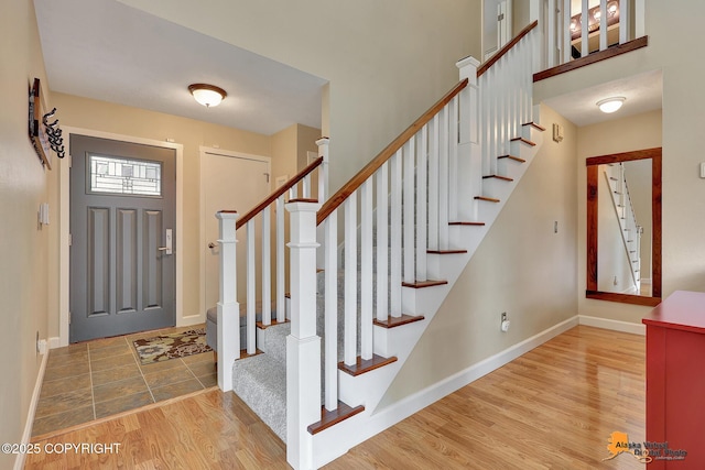 9606 Reliance Dr, Anchorage, AK 99507 - foyer with wood finished floors and stairs