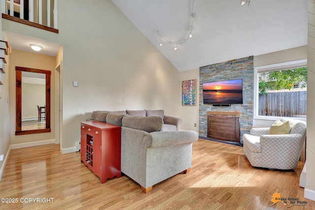 9606 Reliance Dr, Anchorage, AK 99507 - living room featuring light wood finished floors and high vaulted ceiling