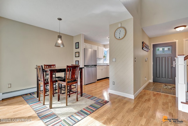 9606 Reliance Dr, Anchorage, AK 99507 - dining room with light wood-type flooring and baseboards