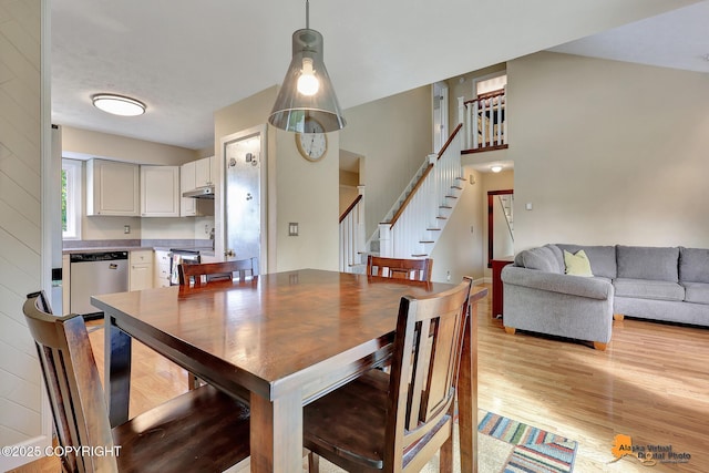 9606 Reliance Dr, Anchorage, AK 99507 - dining area featuring stairway and light wood-type flooring