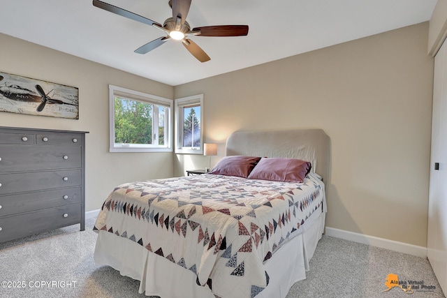 9606 Reliance Dr, Anchorage, AK 99507 - carpeted bedroom with baseboards and ceiling fan