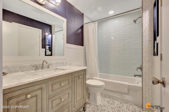 9606 Reliance Dr, Anchorage, AK 99507 - full bathroom with vanity, shower / bath combination with curtain, tile patterned floors, and a wainscoted wall