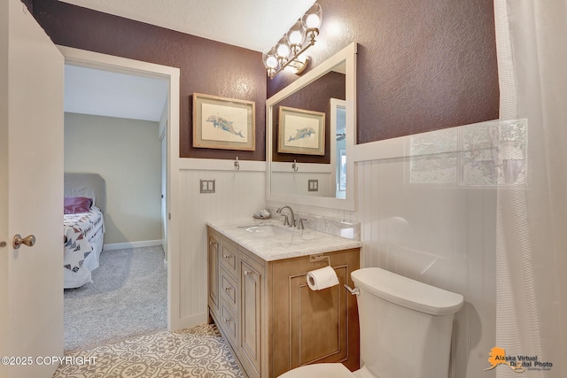 9606 Reliance Dr, Anchorage, AK 99507 - bathroom featuring vanity, tile patterned flooring, and a textured wall