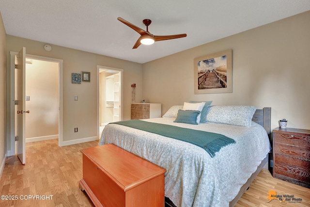 9606 Reliance Dr, Anchorage, AK 99507 - bedroom with light wood-style floors, a ceiling fan, and ensuite bath