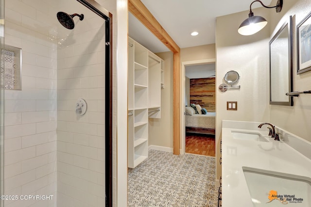 9606 Reliance Dr, Anchorage, AK 99507 - ensuite bathroom featuring a stall shower, double vanity, recessed lighting, and tile patterned flooring