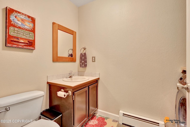 9606 Reliance Dr, Anchorage, AK 99507 - bathroom with baseboard heating and vanity