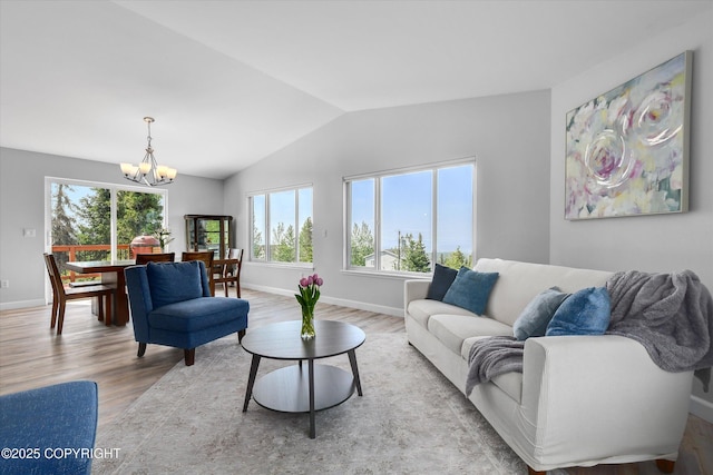 11300 Browder Ave, Anchorage, AK 99507 - living area with a chandelier, wood finished floors, and vaulted ceiling