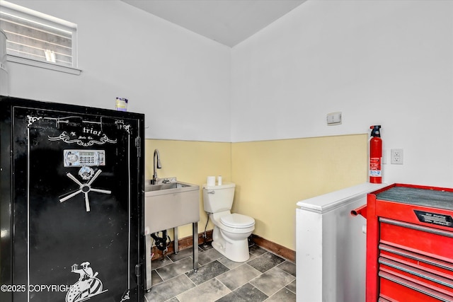 11300 Browder Ave, Anchorage, AK 99507 - bathroom featuring toilet and a sink
