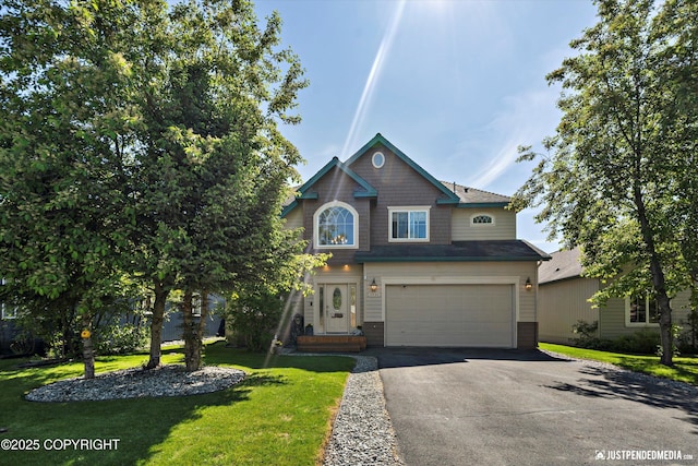 2439 Maritime Loop, Anchorage, AK 99515 - view of front of house featuring driveway, a garage, and a front yard