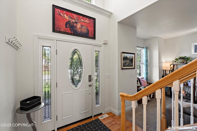 2439 Maritime Loop, Anchorage, AK 99515 - foyer featuring wood finished floors and stairs