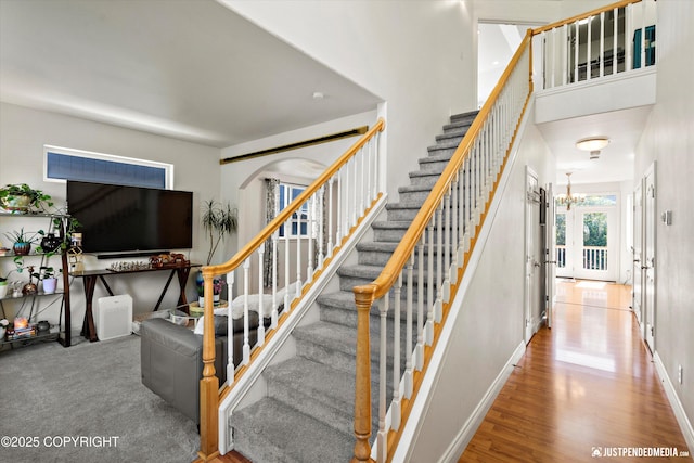 2439 Maritime Loop, Anchorage, AK 99515 - stairway featuring a chandelier and wood finished floors