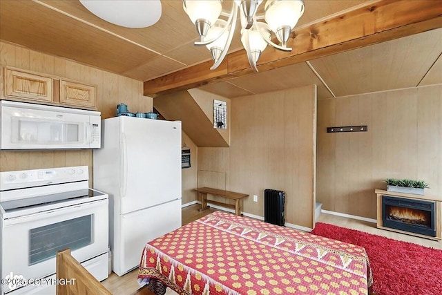 45552 Spruce Ave # 123, Soldotna, AK 99669 - kitchen featuring white appliances, wooden ceiling, wooden walls, a lit fireplace, and a chandelier