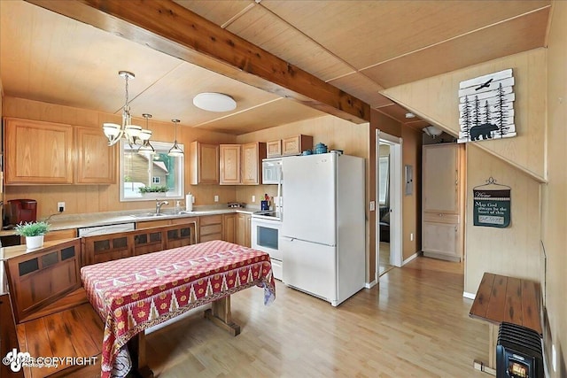 45552 Spruce Ave # 123, Soldotna, AK 99669 - kitchen with white appliances, light countertops, light wood-style floors, a chandelier, and pendant lighting