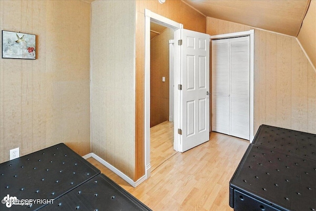 45552 Spruce Ave # 123, Soldotna, AK 99669 - unfurnished bedroom featuring wood finished floors, lofted ceiling, and a closet