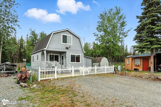45552 Spruce Ave # 123, Soldotna, AK 99669 - dutch colonial with a gambrel roof and a shed