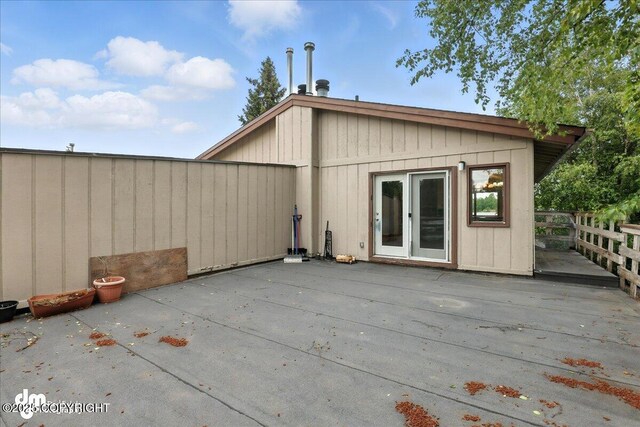 3681 E 20th Ave, Anchorage, AK 99508 - back of house featuring a deck and a patio area