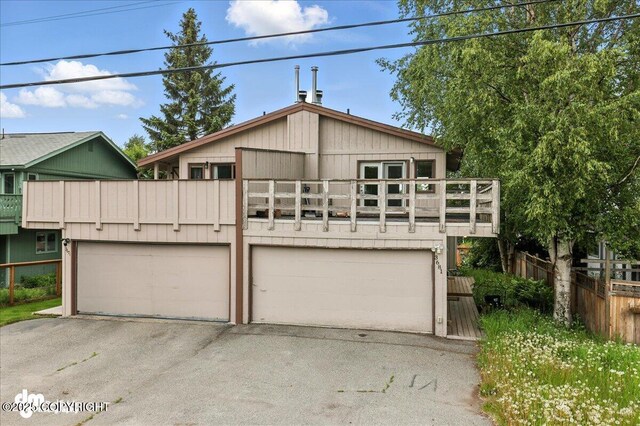 3681 E 20th Ave, Anchorage, AK 99508 - view of front of house featuring a balcony and a garage