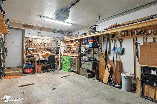 12313 Lake St # C-7, Eagle River, AK 99577 - garage featuring a workshop area and a garage door opener