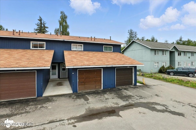 12313 Lake St # C-7, Eagle River, AK 99577 - view of front of property with a garage