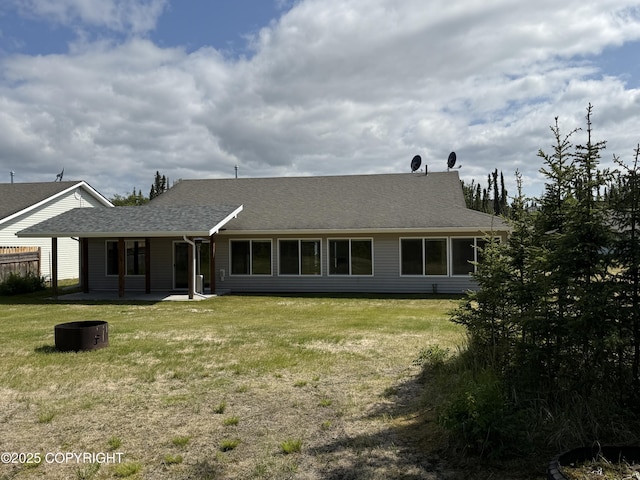 123 Green Valley St, Soldotna, AK 99669 - rear view of house featuring a patio, a lawn, and a shingled roof
