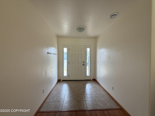 123 Green Valley St, Soldotna, AK 99669 - entrance foyer featuring baseboards and light tile patterned flooring