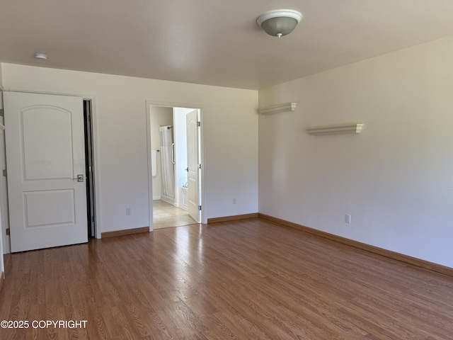 123 Green Valley St, Soldotna, AK 99669 - unfurnished room featuring wood finished floors and a smoke detector