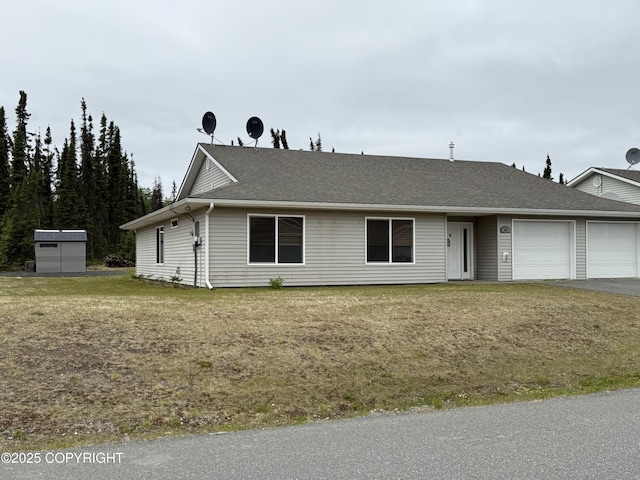123 Green Valley St, Soldotna, AK 99669 - ranch-style house featuring a garage, roof with shingles, and asphalt driveway