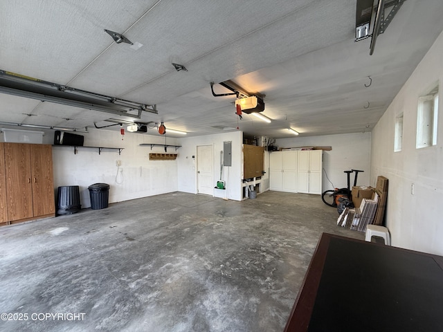 123 Green Valley St, Soldotna, AK 99669 - garage featuring electric panel and a garage door opener