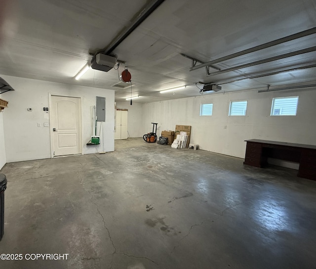 123 Green Valley St, Soldotna, AK 99669 - garage featuring a garage door opener and electric panel