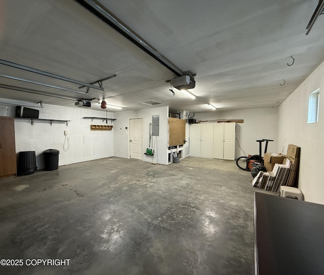 123 Green Valley St, Soldotna, AK 99669 - garage with a garage door opener and electric panel