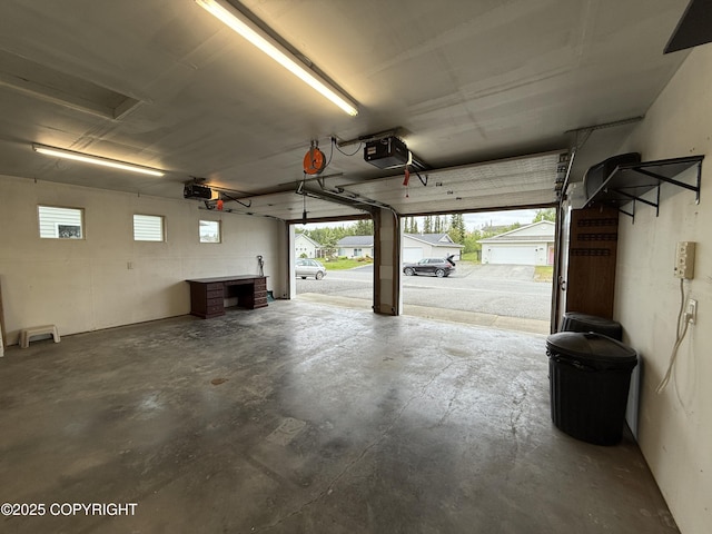 123 Green Valley St, Soldotna, AK 99669 - garage featuring a garage door opener