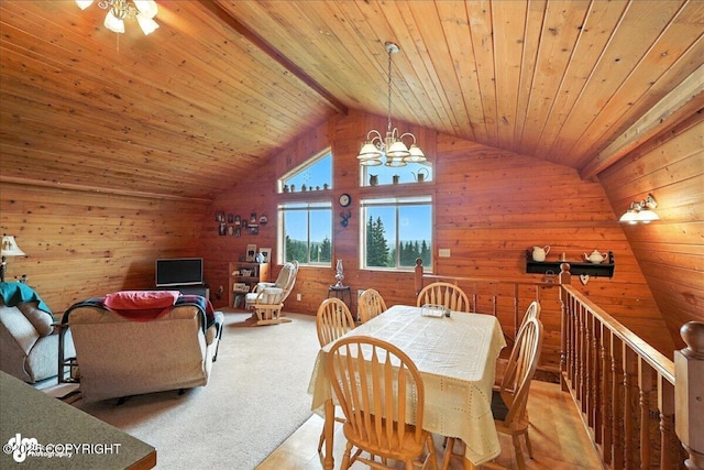 64320 Trail Rd, Anchor Point, AK 99556 - carpeted dining room featuring wood walls, a chandelier, wood ceiling, and high vaulted ceiling